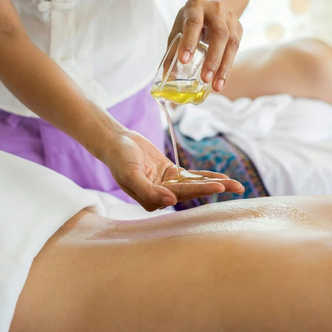 Oil massage preparation with warm oil